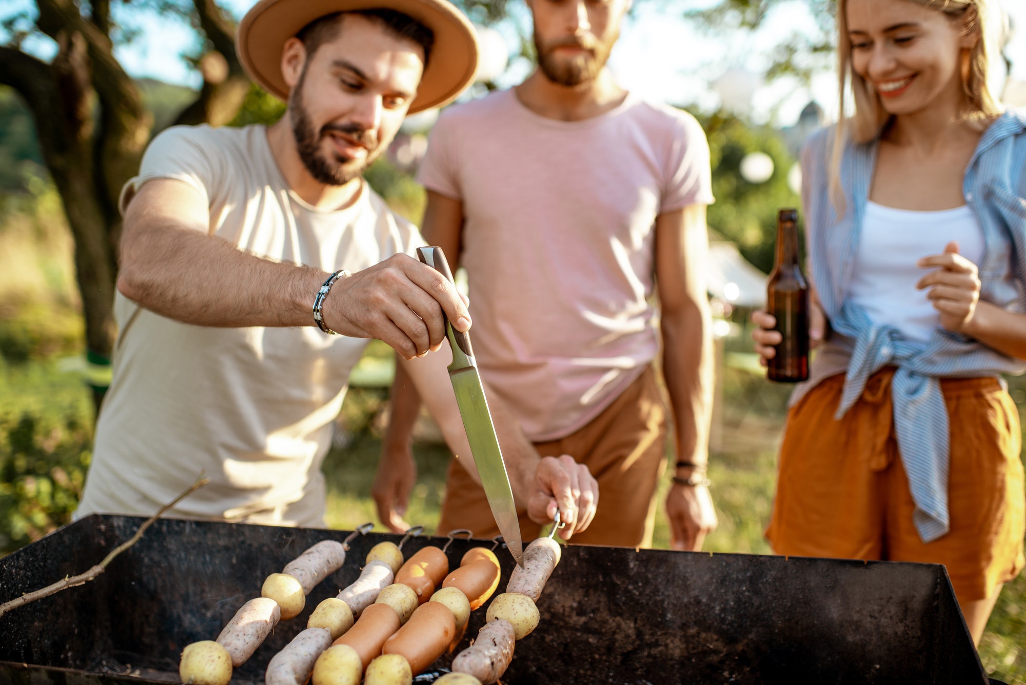 Friends having barbecue in the garden